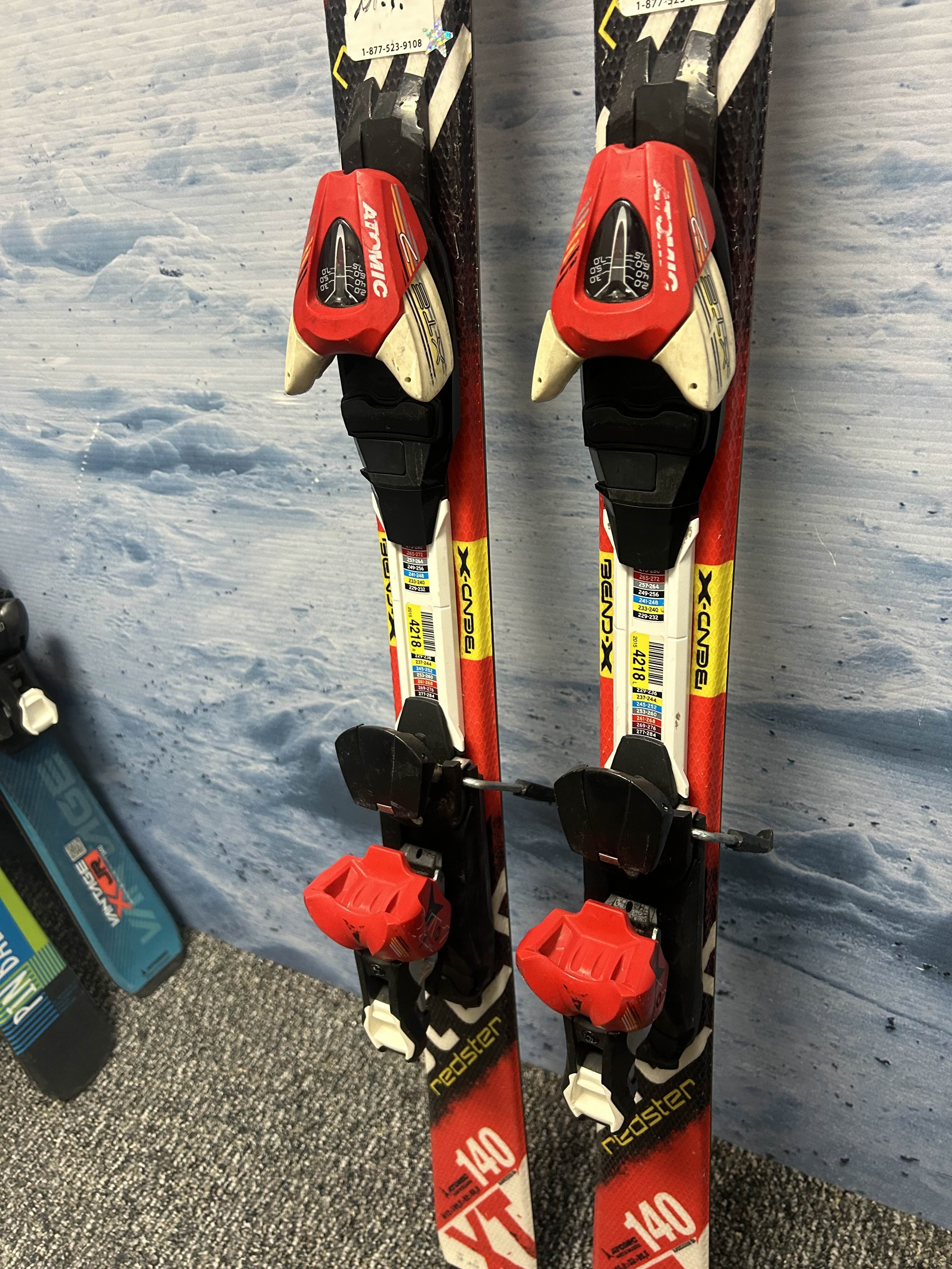 Used Atomic Redster 140cm Jr Skis w/ XTE 7 Demo Binding