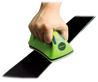A product image showing a hand holding the Wintersteiger Wax Iron for Ski & Snowboard Waxing, the hand is guiding the wax iron across the base of a ski.