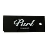 Zoomed out shot of the Purl Wax Scraper for removing ski wax from skis.
